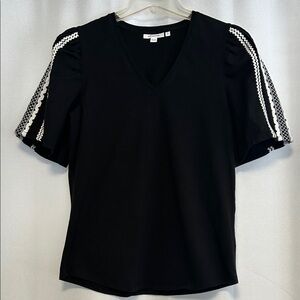 Chico's Elegant Black V-Neck Top with White Sleeve Detail